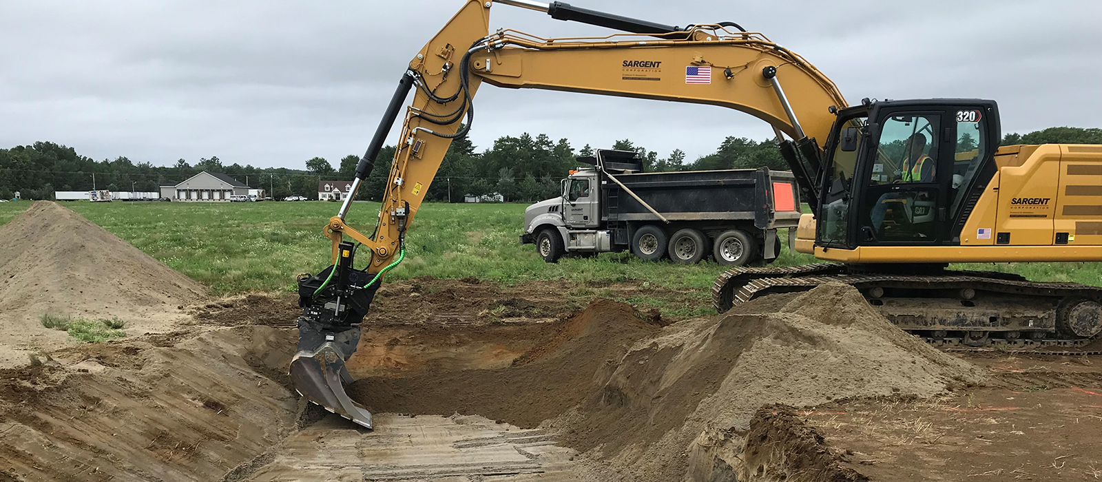 Large Excavator Moving Fine Soil At Milo Borrego Solar Site
