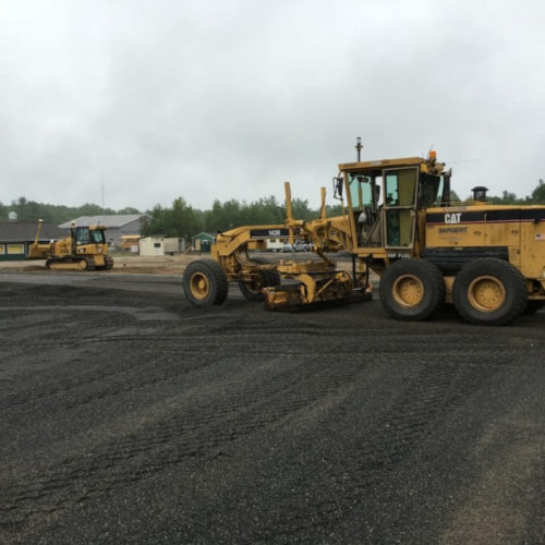 Our Crew Manuevering Motor Graders working on track and field complex