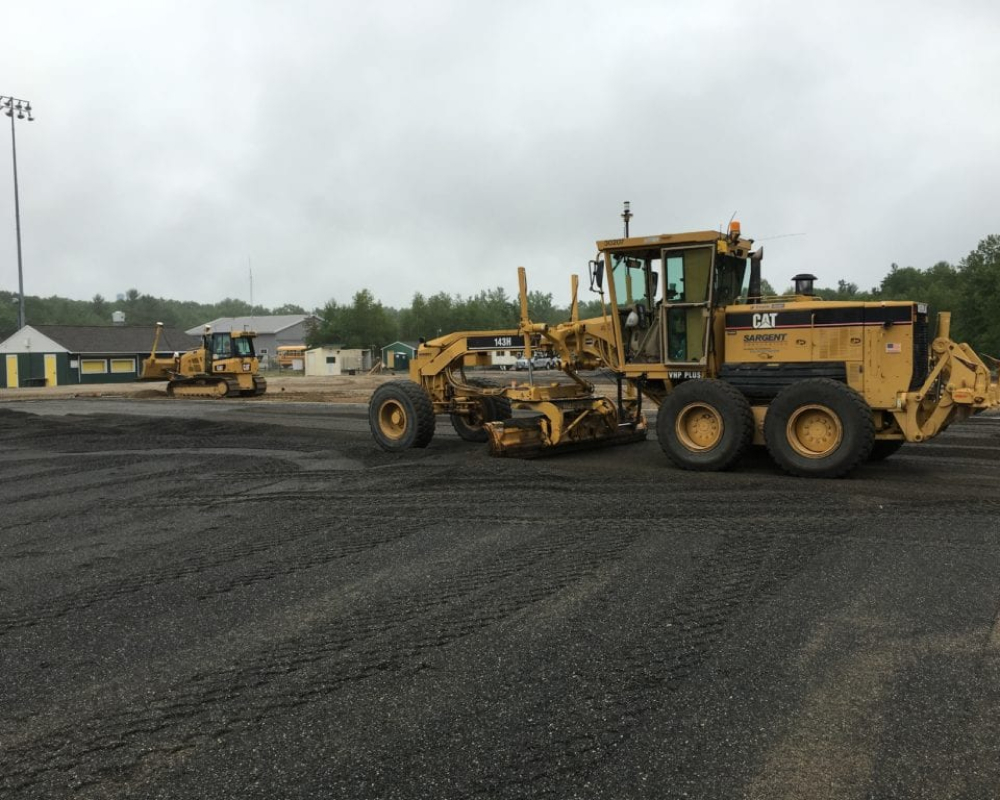 Our Crew Manuevering Motor Graders working on track and field complex