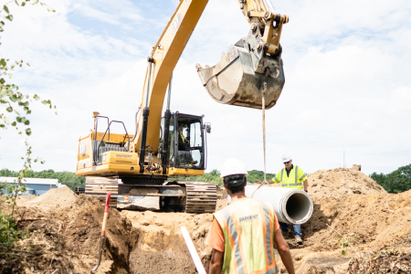 Excavator Claw Lifting Concrete Sewer Pipe